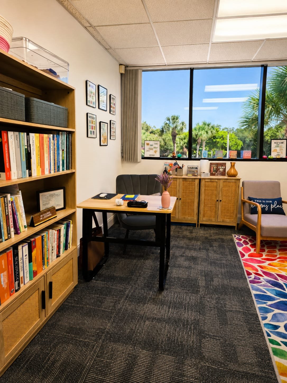 Desk and bookshelf in Carol Afonso’s Deerfield Beach office